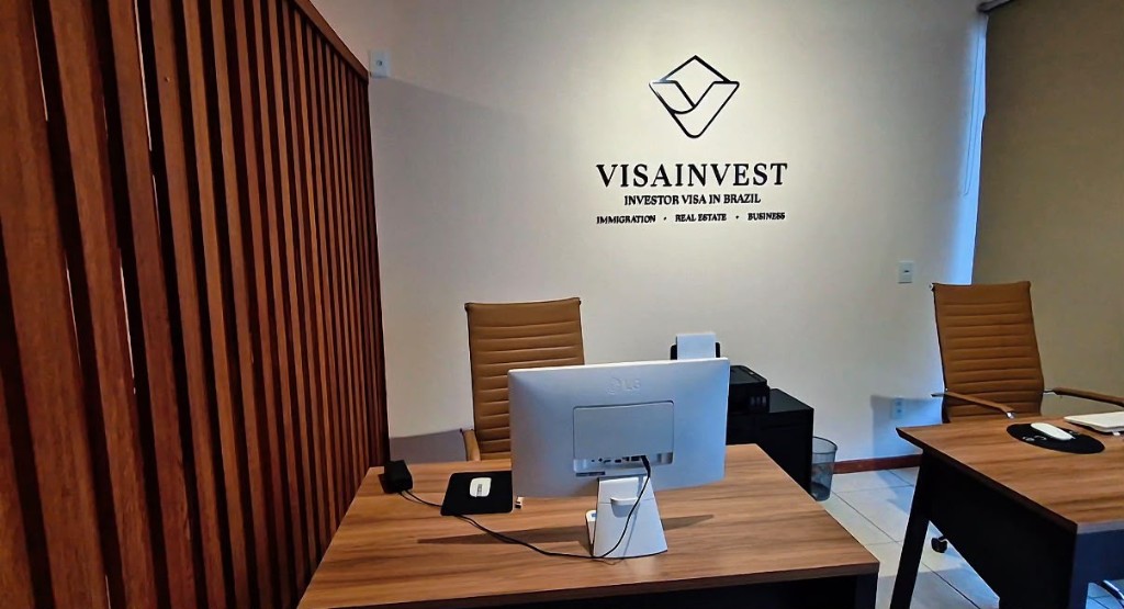 Reception desks and VisaInvest logo wall